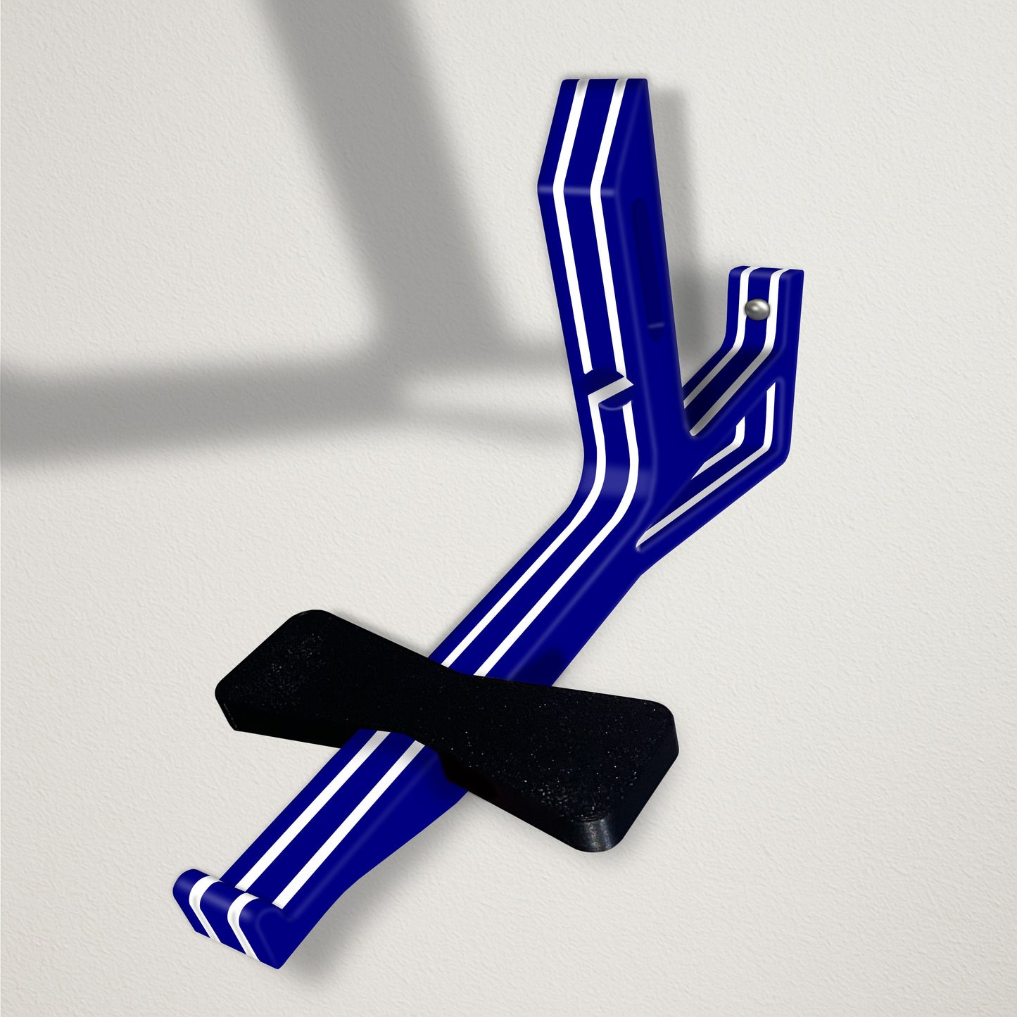 Angled baseball cap butler display organizer mount - navy with white stripes on a clean wall