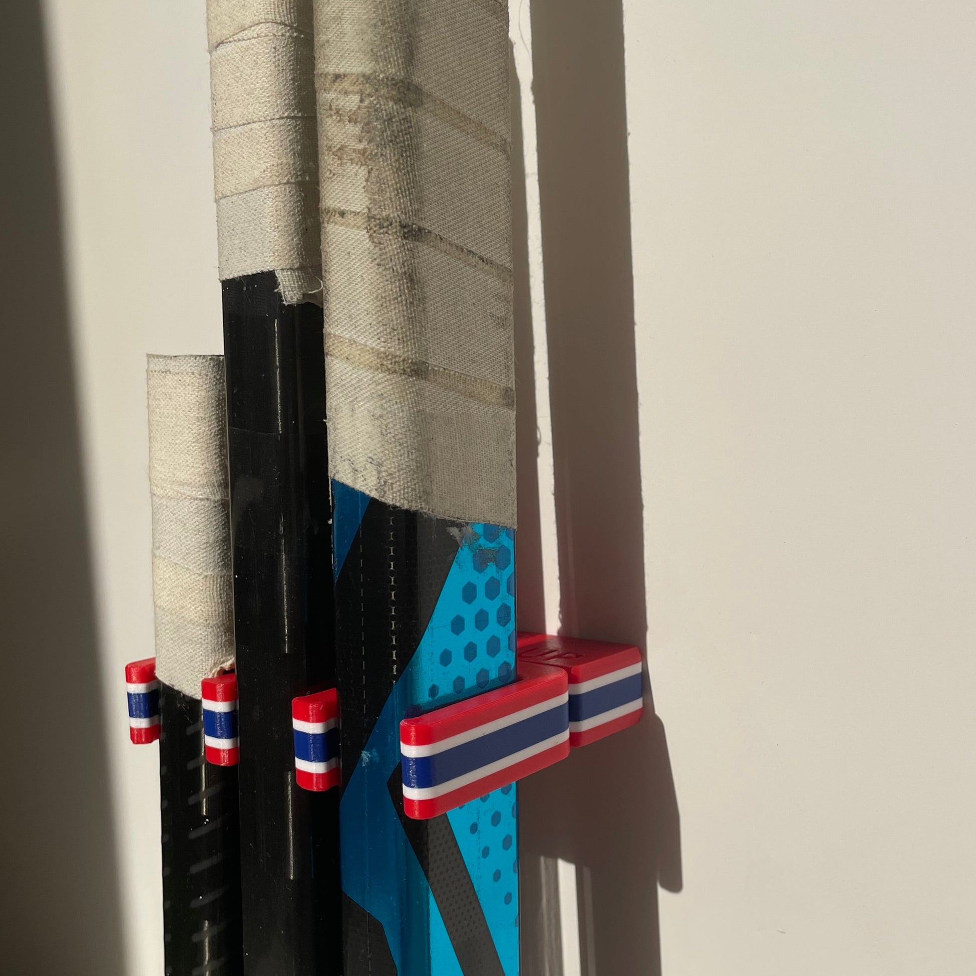 Stick Em Up Hockey Stick Holder - Goalie Bundle - Red White Blue - Wall Mounted Hockey Stick Rack - Isometric View