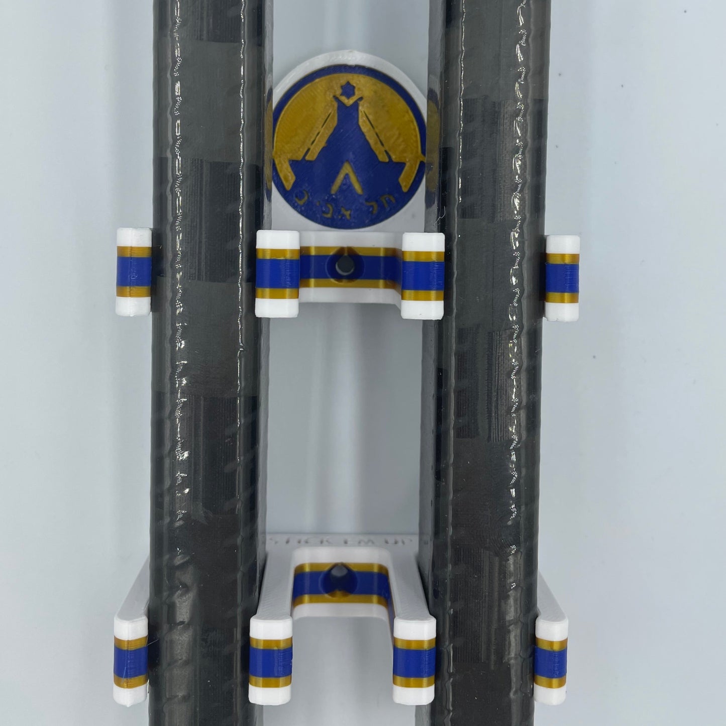 Tel Aviv Hockey Club Stick Em Ups mounted with two hockey sticks to demonstrate their IEHL (Israel Elite Hockey League) logo on the custom Stick Em Up Backing