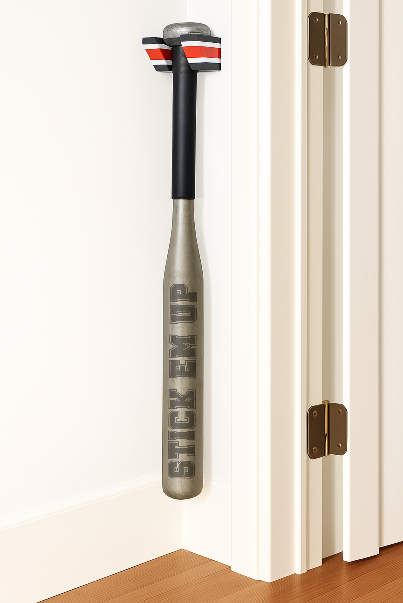 A Black, White, and Red Single Baseball Bat Holder Mounted against a wall near a doorframe.