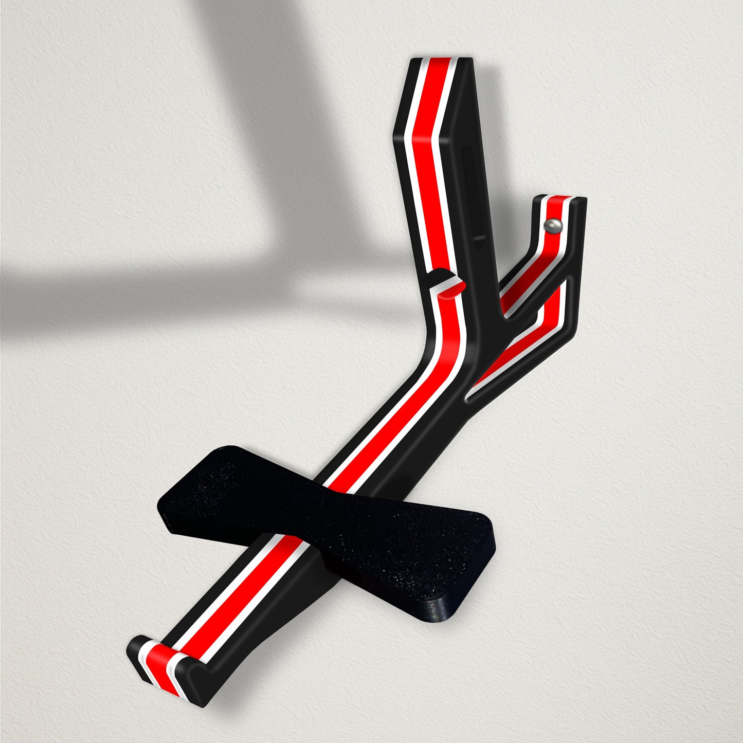 Angled baseball cap butler display organizer mount - black with thin white accents and a thick red stripe on a clean wall