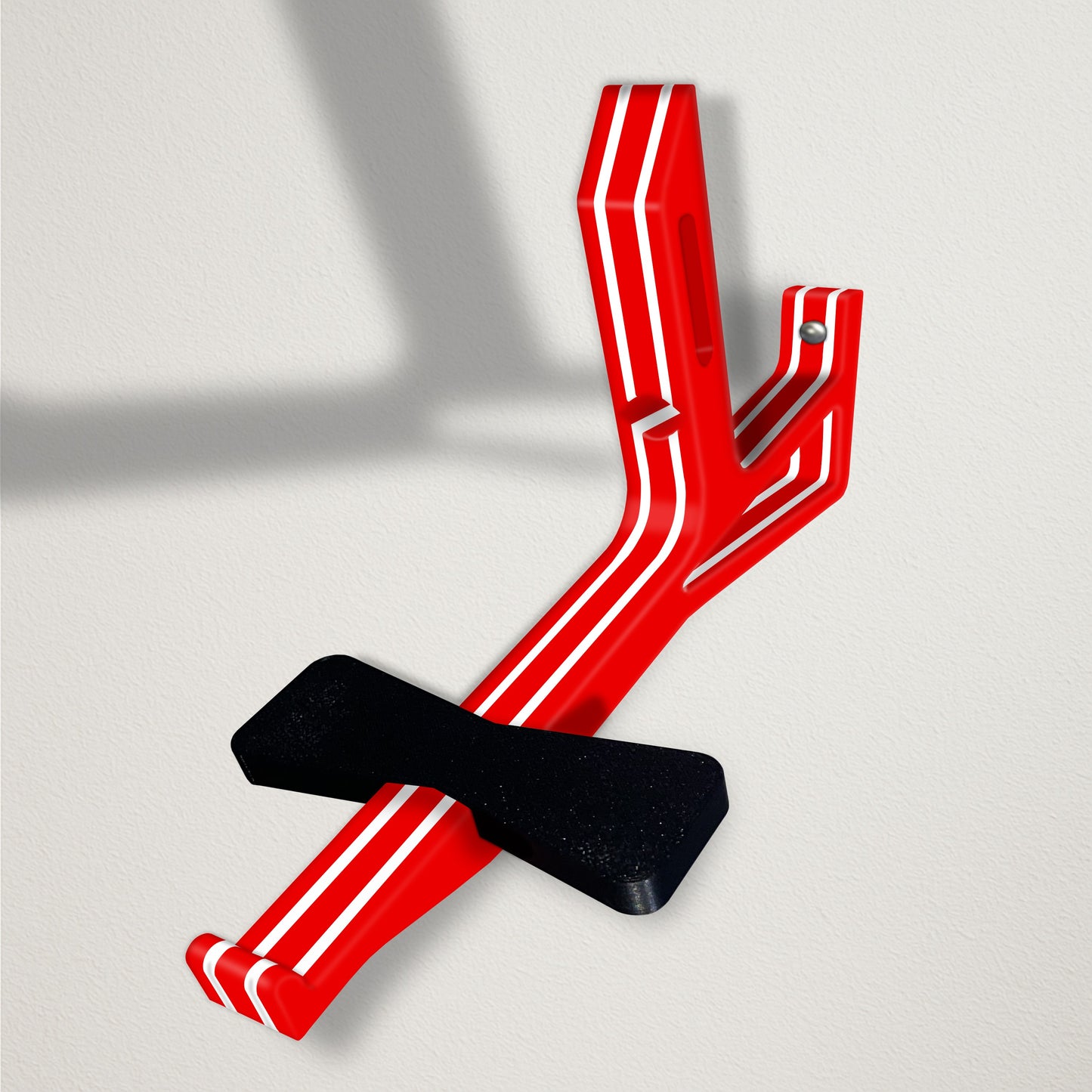 Angled baseball cap butler display organizer mount - red with white stripes on a clean wall