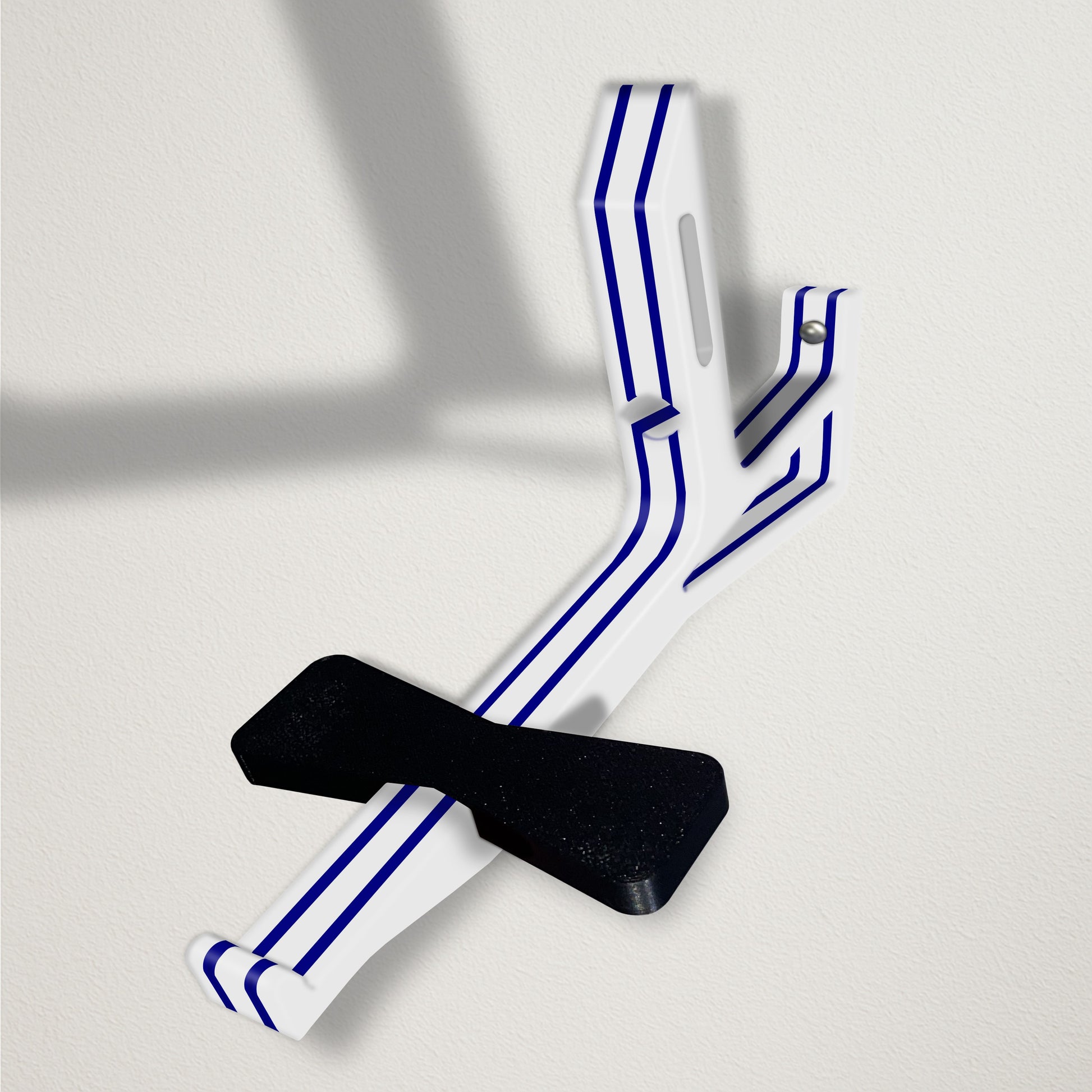 Angled baseball cap butler display organizer mount - white with navy stripes on a clean wall