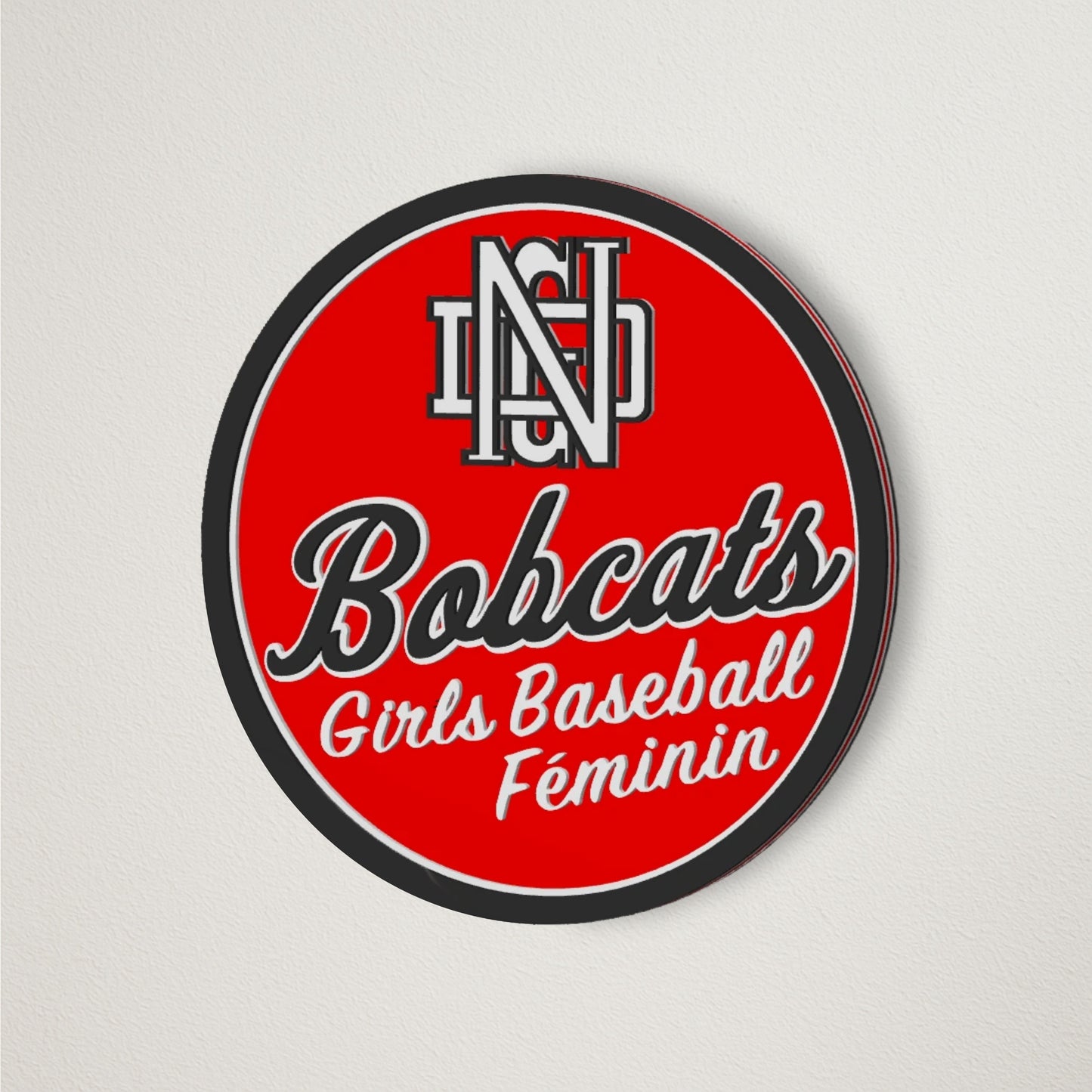 NDG Bobcats Baseball Girls Baseball Feminin logo plaque displayed on a clean wall showcasing the team spirit through its logo and colors 