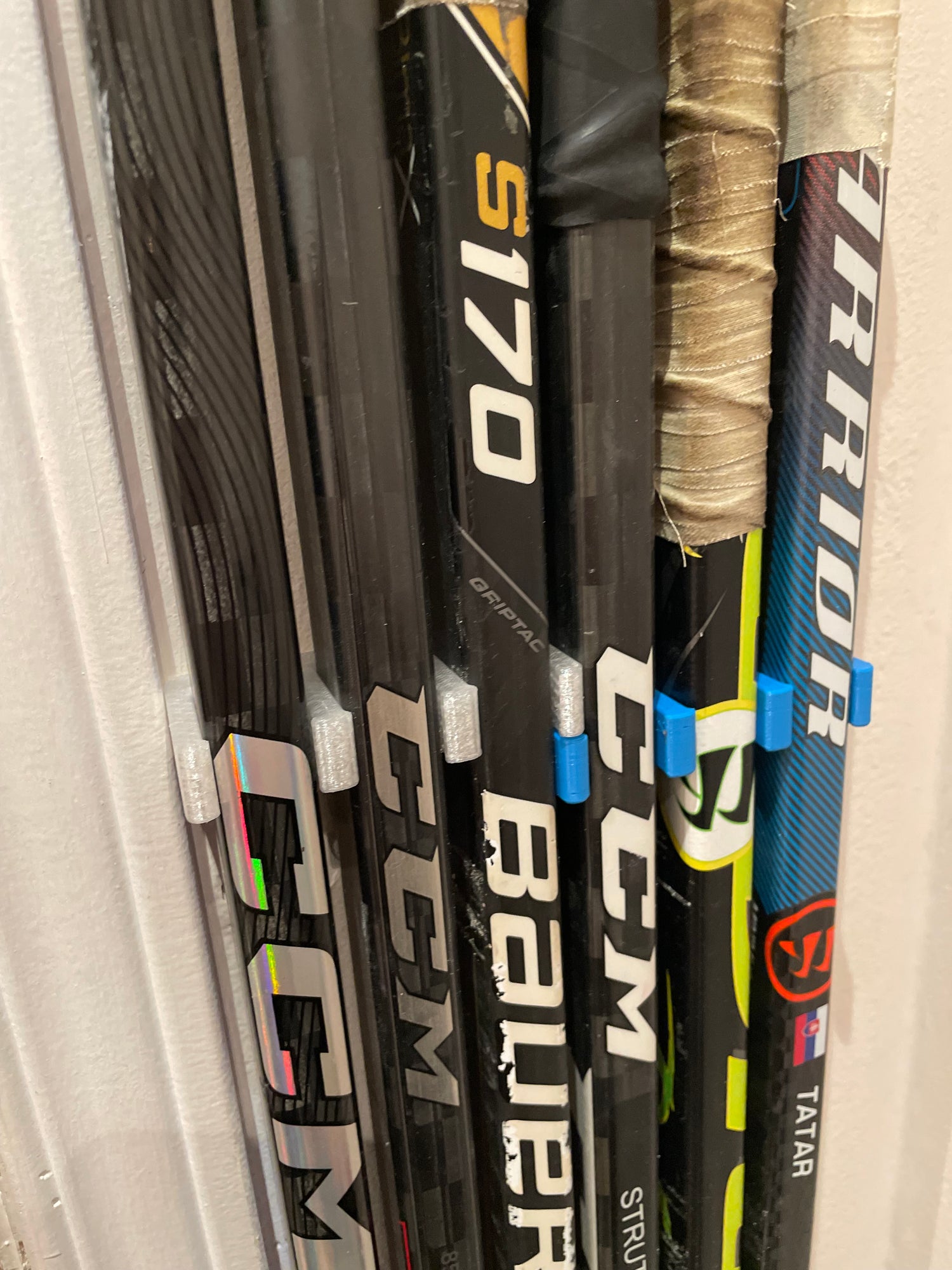 Home setup of single colored Stick Em Ups aligned vertically against the wall